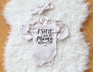 Baby girl long sleeve onesie with ruffles on the sleeve made of heather beige 100 percent interlock cotton in heather beige cotton. The bodyuit comes together with a knot headband in the same color. The onesie has i got it from my mama print on it.
